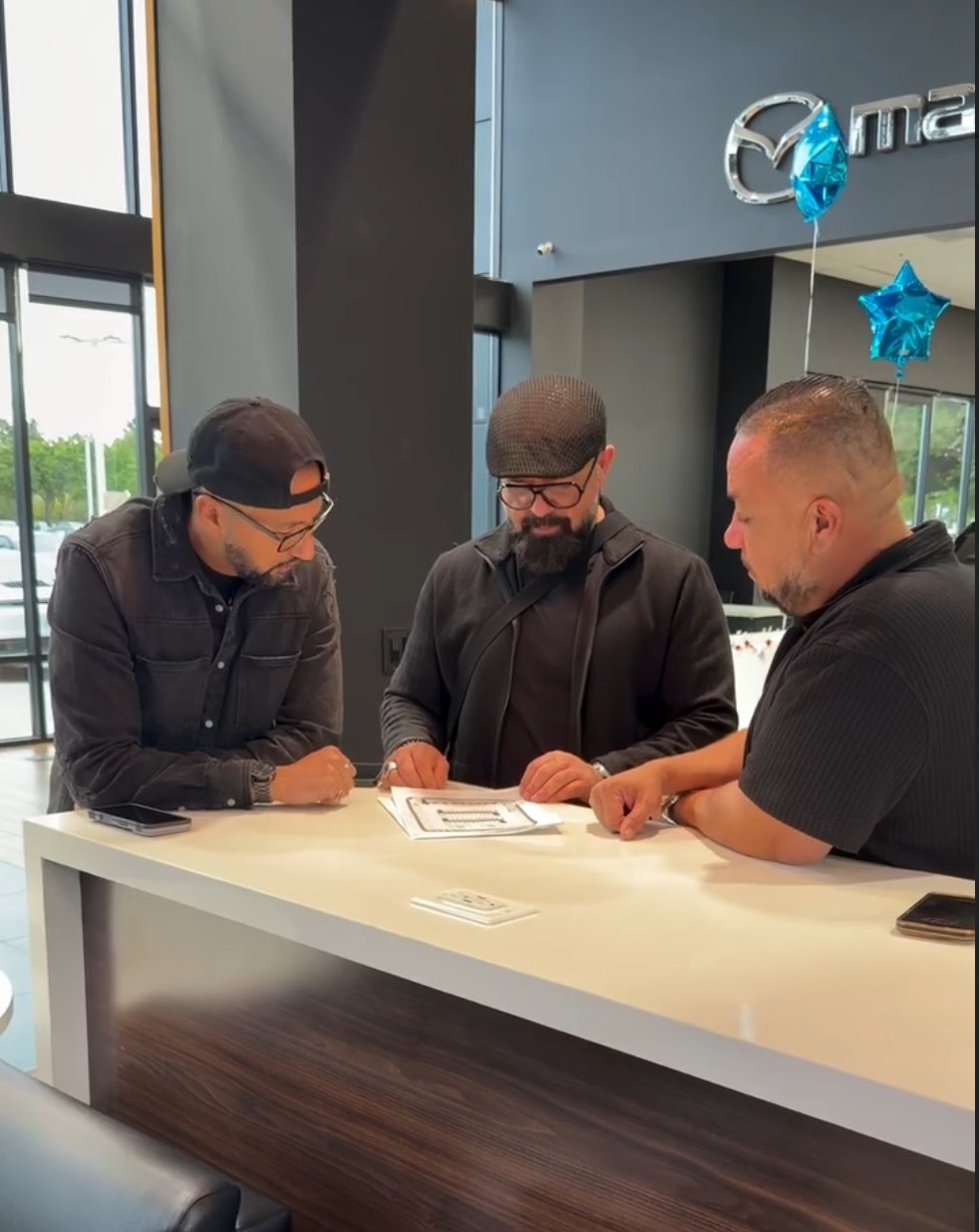 Alex reviewing strategy on location at the dealership